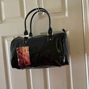 NWTQueen by Queen Latifah black embossed logo tote bag .